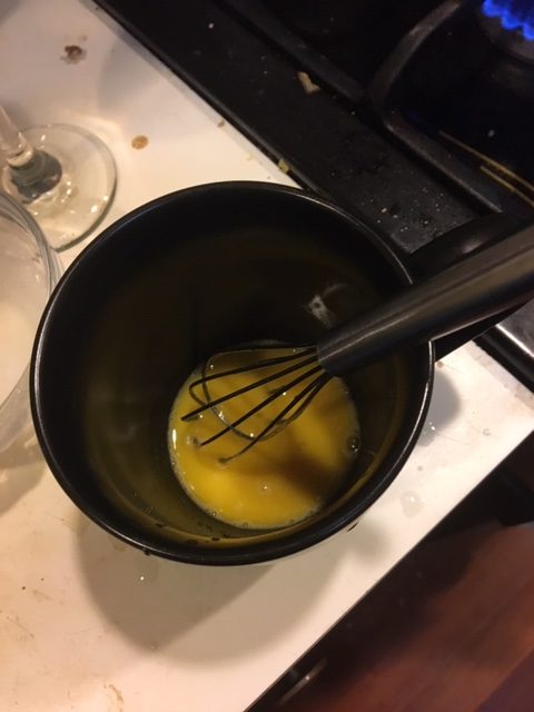 egg yolk, sugar and brandy beaten together in a mug.