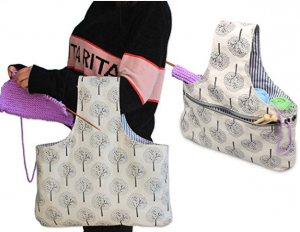 Wrist tote for knitting work in progress, with a large loop for the bag to wear on one wrist, a divided section fory arn and the work in progress, and grommests to feed the yarn through