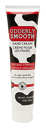 Udderly Smooth Hand Cream 4oz tube with red label and black and white cow print on the tube