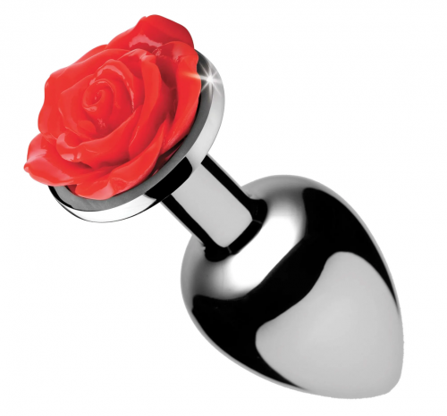 A dark metal butt plug with a rose topper.
