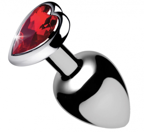 Dark metal anal plug with red heart gem topper.
