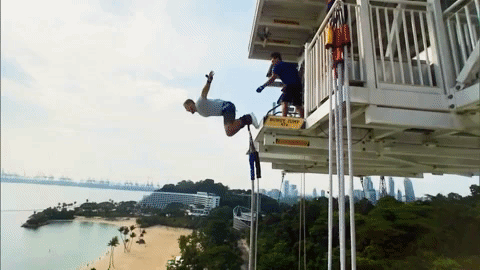 Colton jumps off a platform. He's strapped to a bungy cord unfortunatley