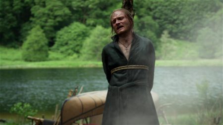 Father Ferigault is tied to a stake. 