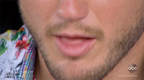 A super gross close up of Colton's mouth as he chews and licks his fingers