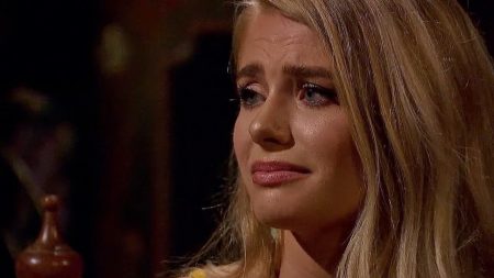 A close up of Demi crying.