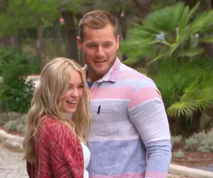 Colton and Cassie smile as they explore Portugal.Also his shirt is too small across his biceps and chest