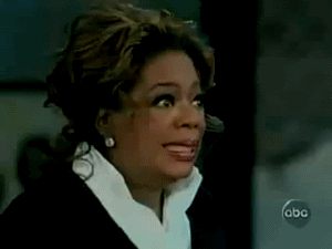 Oprah grimacing