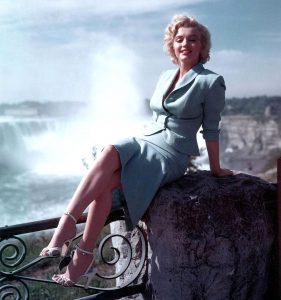 Marilyn Monroe in front of the Falls in a Blue suit