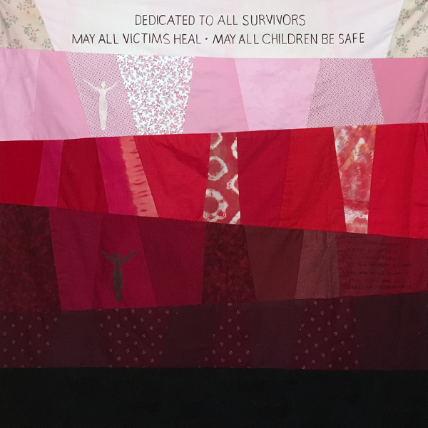 Cleo's square, with offset stripes of patchwork fabric going from white and cream to pink, then red, burgundy, darker red, and black at the top it says dedicated to app survivors may all victims heal may all children be safe 