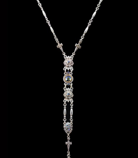 Silver Y necklace with beads of idfferent shapes in a long tassel down the front