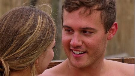 Peter and Hannah sit in a hot tub