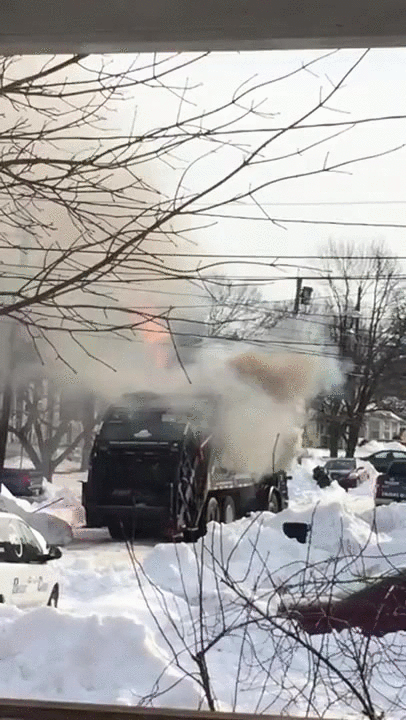 A garbage truck explodes into flames