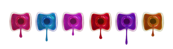 Bottles with spilled nail polish over white background — Photo by urfingus