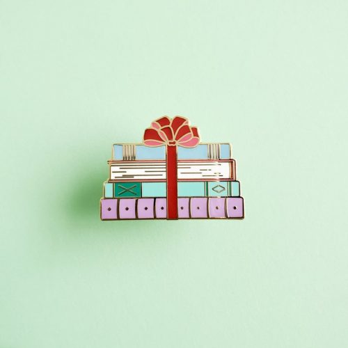 Enamel pin of a stack of books