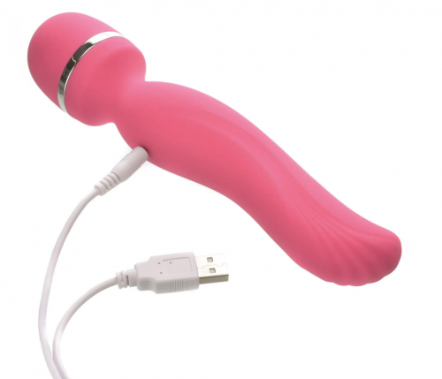 A pink personal massager with a white USB cord.