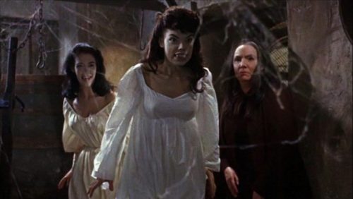 Brides of Dracula - ferocious fanged women and cobwebs.
