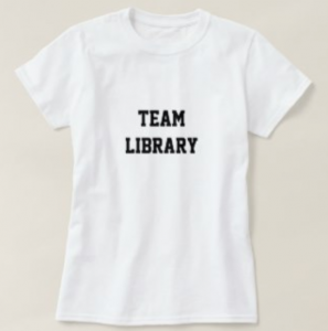 A white tshirt with TEAM LIBRARY in black letters 
