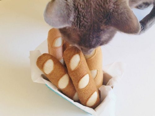 A felt baguette cat toy filled with catnip.