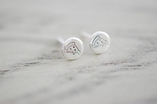 Silver stud earrings stamped with a pizza design