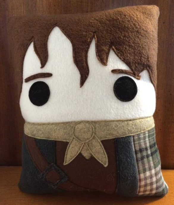 A felt fleece pillow styled to look like Jamie from Outlander