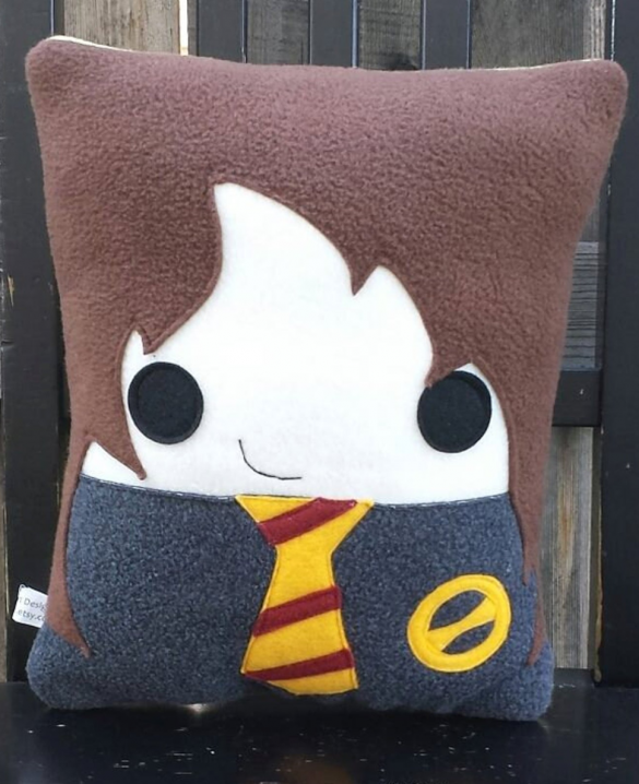 A fleece pillow styled to look like Hermoine