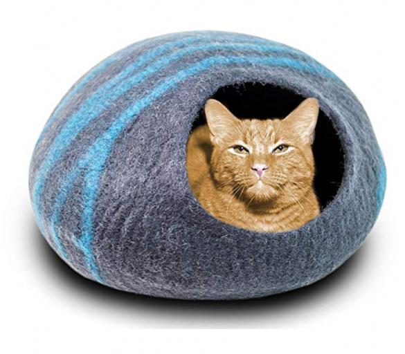 Felted kitty cave in blue with an orange tabby inside looking very smug