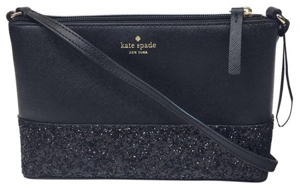 Black crossbody Kate Spade in black with leather on the bottom third of the bag
