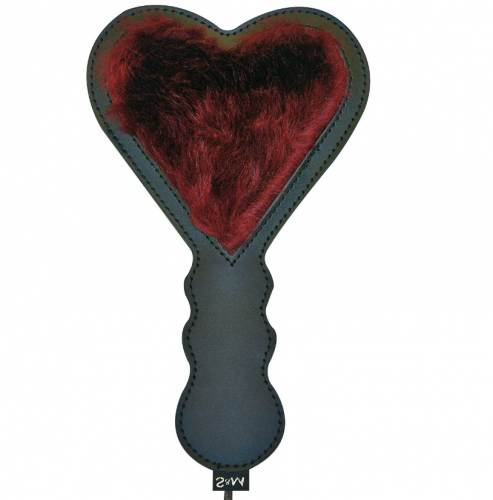 A heart shaped paddle with red faux fur.