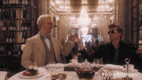 The two of them clinking glasses of champagne