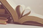 Pages of a book folded into a heart shape