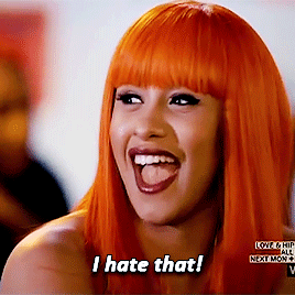 Cardi B in a glorious orange wig saying "I hate that!" Me too, girl, me too.