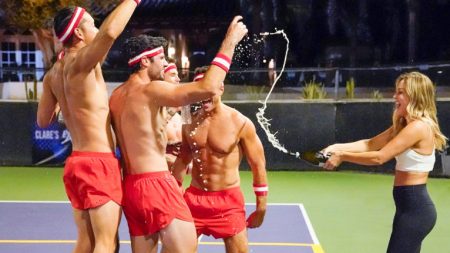 Clare sprays the red team with champange