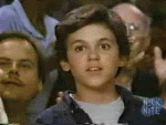 a young fred savage gives a slow mo thumbs up