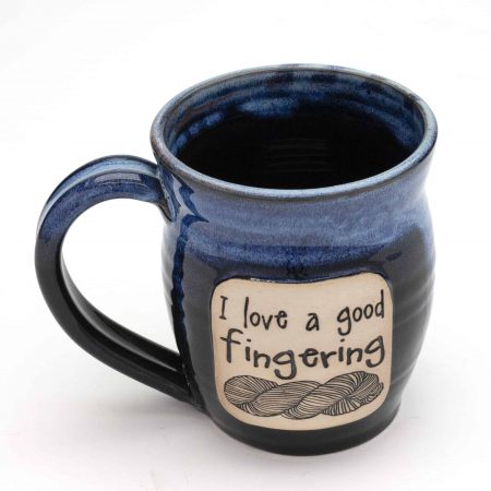 A mug that has a skein of yarn on it and says I love a good fingering