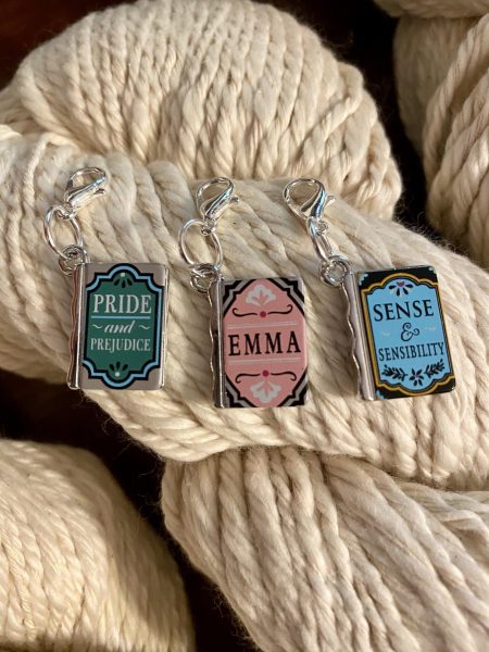 Stitch markers shaped like Jane Austen novels