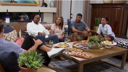 Tayshia's family sits around a table