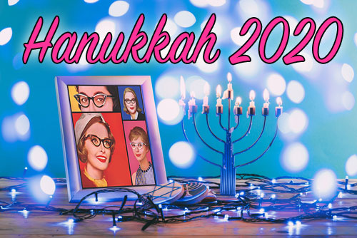 Smart Bitches Hanukkah 2020 with a menorah and a frame of the Ladies logo of the site on a table with blue lights