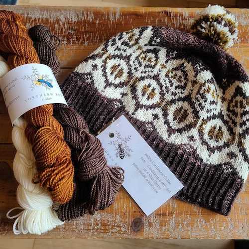 cream brown and grey yarn and a patterned knit hat