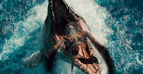 a mosasaurus from jurassic park leaps from the ocean to devour a fleeing pterosaur