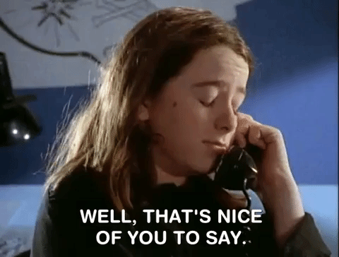 A girl talking on the phone says well thats nice of you to say