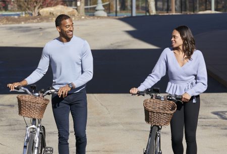 Matt and Michelle walk next to their bikes