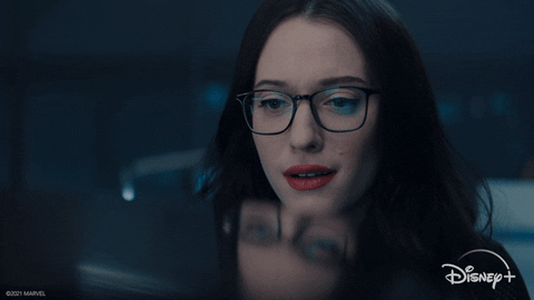 Darcy from Wanda Vision looking at something and her face crumpling with emotion