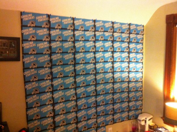 A wall covered with a massive tile of 140 Carolina Panthers napkins