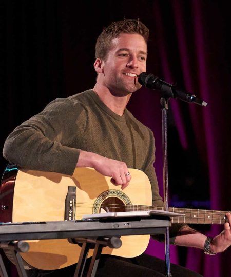 Connor plays the guitar