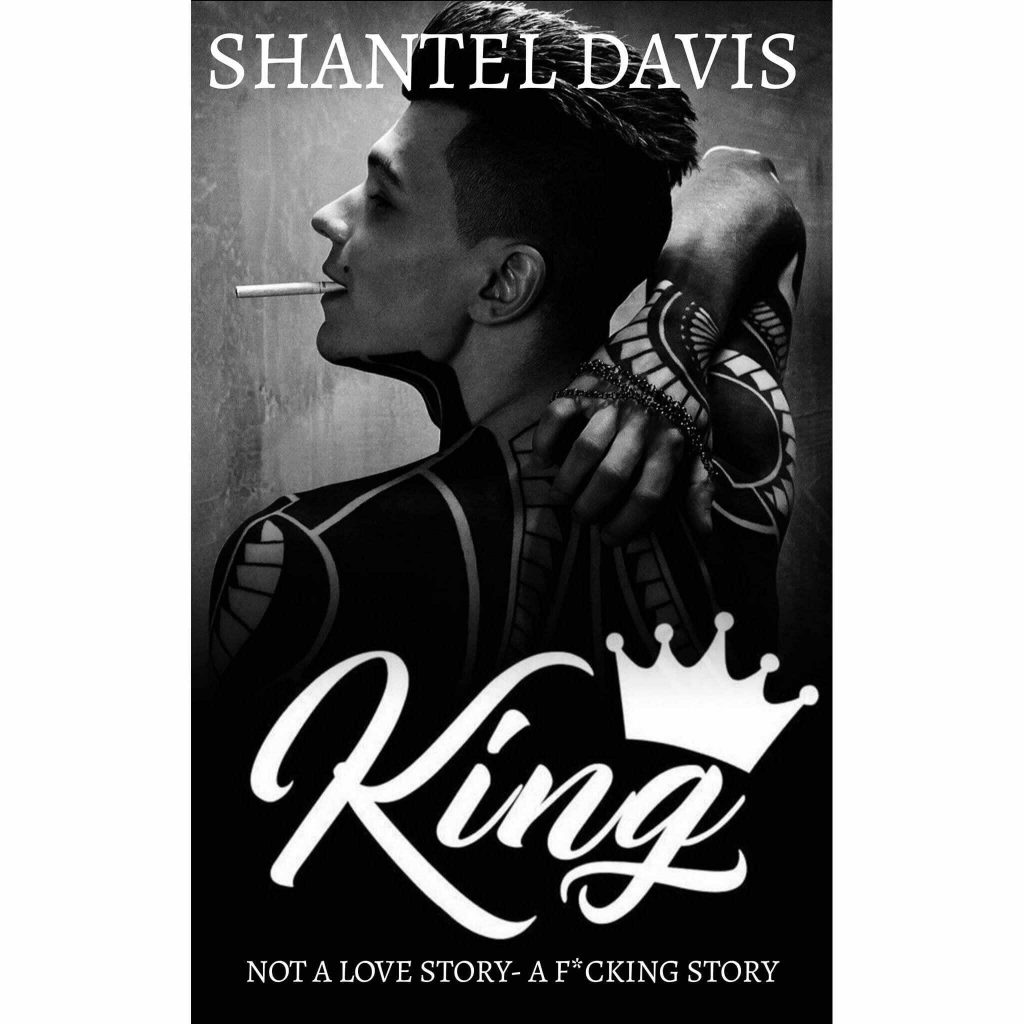 King by Shantel Davis. A black and white cover. A man is smoking. His arms and shoulders heavily tattooed and he's reaching his arm behind him to try and get the middle of his back.