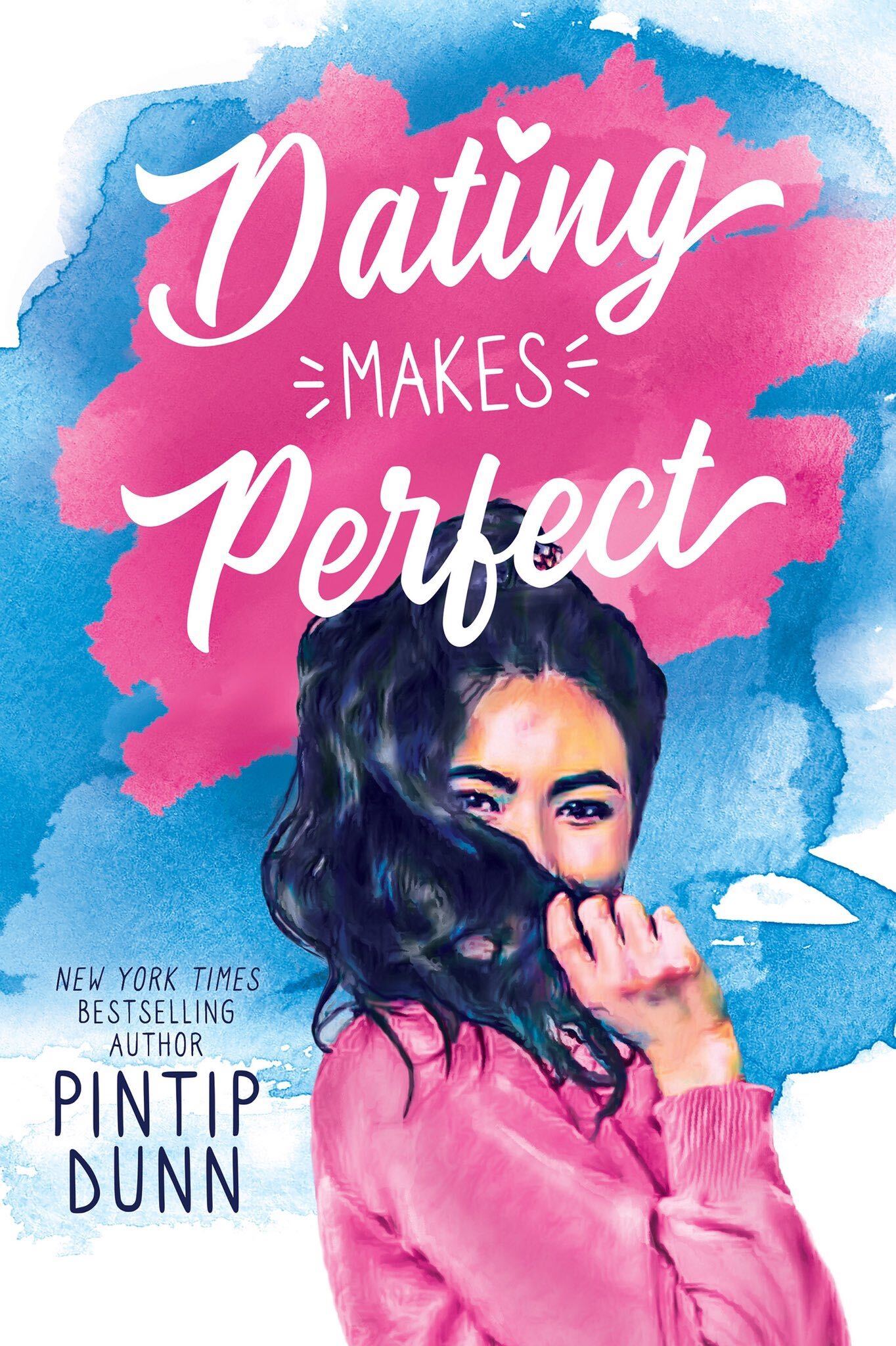 Dating Makes Perfect by Pintip Dunn. Pink and blue strokes of watercolor make up the background. A dark-haired girl in a pink sweater hides behind her pony tail.