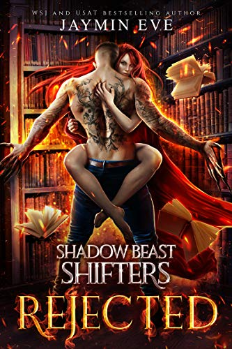 Shadow Beast Shifters Rejected by Jaymin Eve. A man and woman are both on fire in a study or library. She is wrapped around him, legs around his waist and his arms are outstretched to the sides.