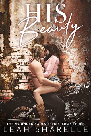 His Beauty by Leah Sharelle. A man and woman are making out on a motorcycle. He is sitting on it and she's sitting on him.