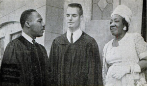 Martin Luther King, Jr and Henry Elkins, in pastoral robes, talking to Alberta, who is wearing a light-color dress