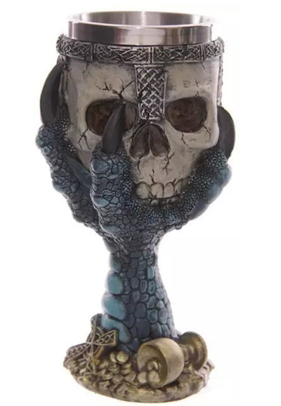 A resin and stainless steel goblet of a blue dragon's claw holding a skull wearng a metal crown and yeah you drink out of the skull part